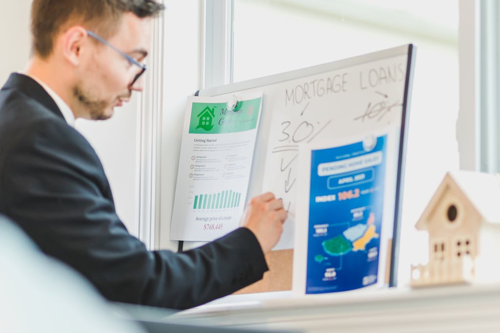 A Man Writing on White Board