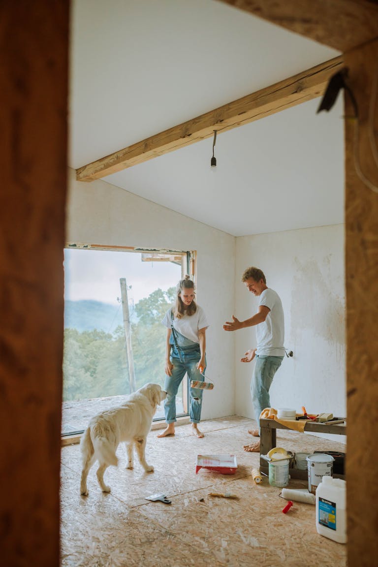 Couple with Dog in House under Renovation discuss how much equity they are adding