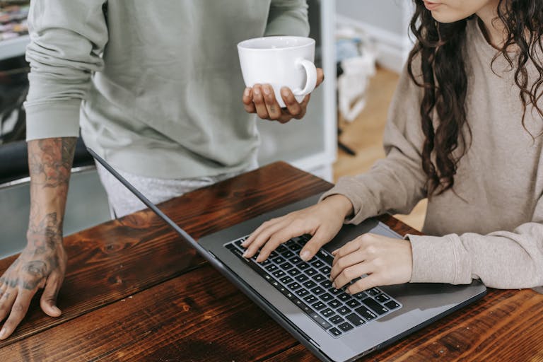 Woman In Brown Long Sleeve Shirt Using Macbook Pro to google best mortgage broker perth