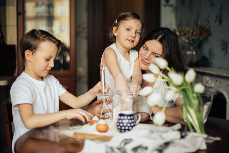 a single mother at home with her children wondering how she can secure a home loan for single parents in Perth