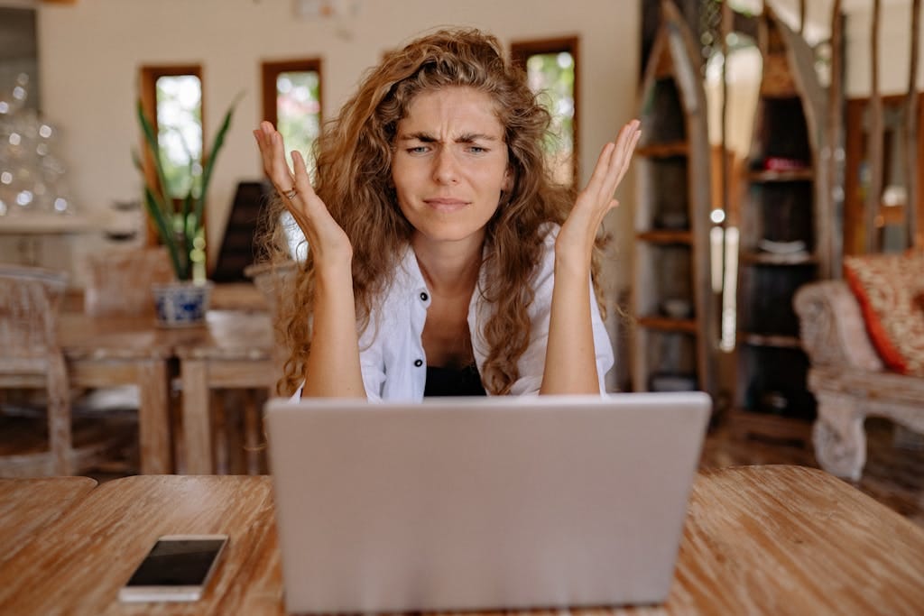 A woman frustrated with her digital lender, considers if she should've used a mortgage broker to reduce stress.