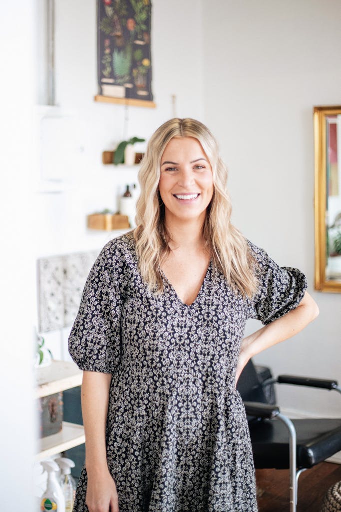 Female entrepreneur, showcasing welcoming environment after having commercial loan approved perth